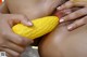 A woman is eating a corn on the cob.