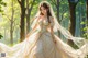 A woman in a wedding dress standing in the woods.